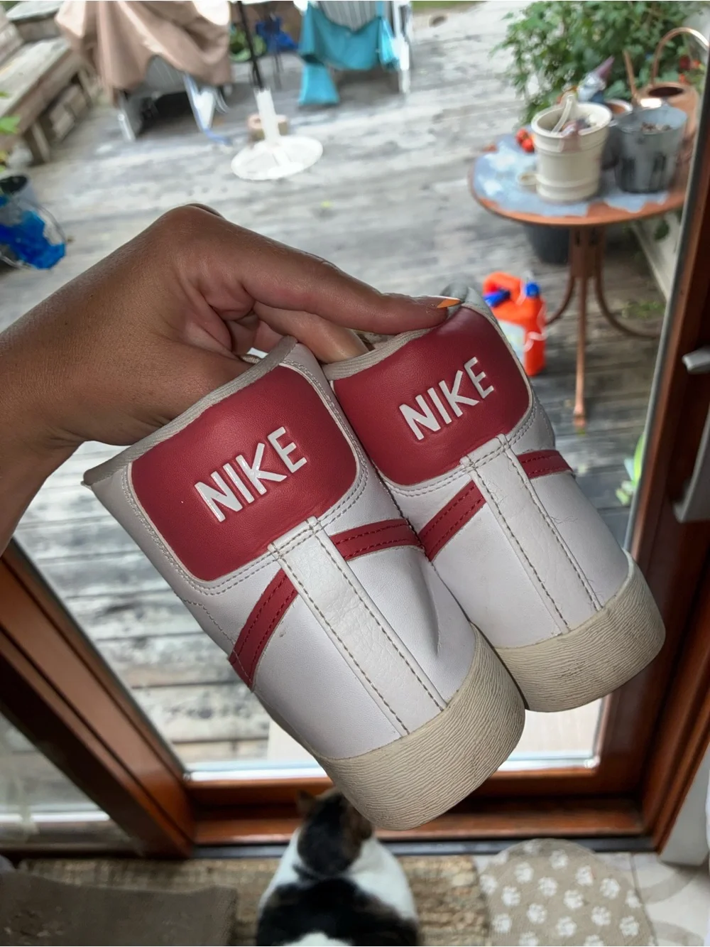 Nike Women's White High-Top Sneakers with Red Swoosh